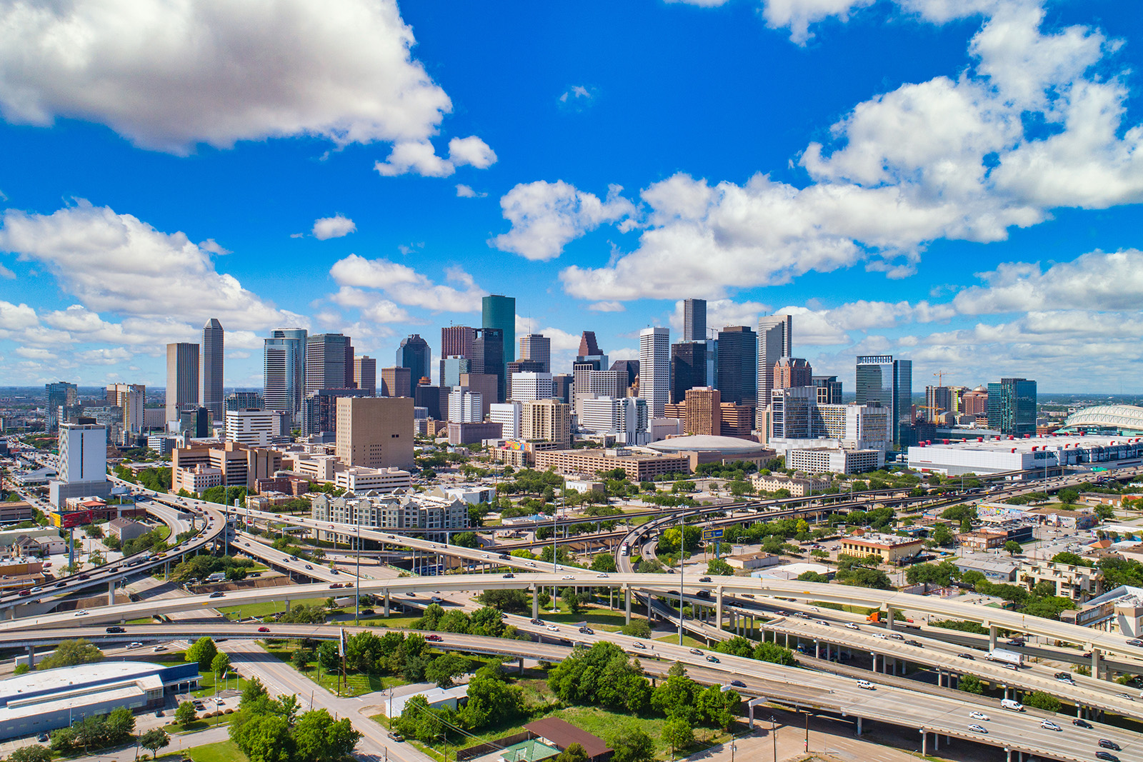 Skyline with downtown buildings under a bright blue sky